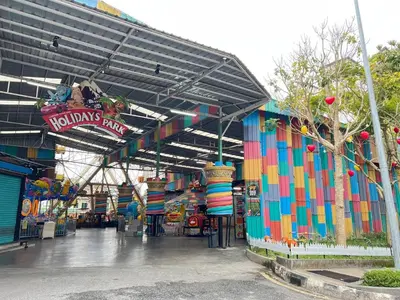 a colorful building with a kinks party sign on it at Delisha 2 Homestay 3R2B The Retreat Nova Kae Farm in Brinchang