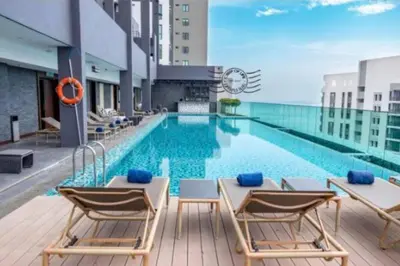 a pool on the roof of a building at jazz suite 2 bedroom sea view apartment in Tanjung Bungah