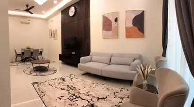 a living room with a couch and a table at Homestay Muslim Gunung Rapat Ipoh in Ipoh