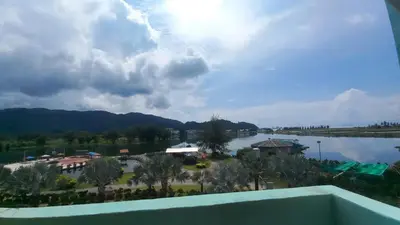 a view of the lake from the balcony of a resort at Laguna Apartment 2, Marina Island Homestay in Kampong Batu Gajah