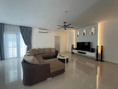 a living room with a couch and a tv at Bichrome Marina Island Private Villa Pangkor Lumut in Lumut