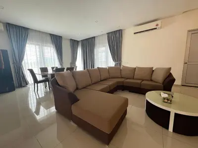 a living room with a couch and a table at Bichrome Marina Island Private Villa Pangkor Lumut in Lumut