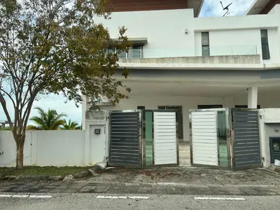 a white house with two doors in front of it at Bichrome Marina Island Private Villa Pangkor Lumut in Lumut
