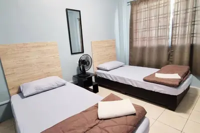 a room with two beds and a mirror at CH Homestay Tanah Rata, Cameron Highlands, Keyless Entry in Tanah Rata