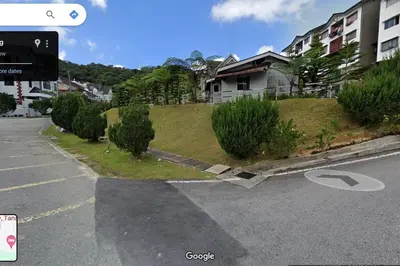 an intersection of an empty street with a building at CH Homestay Tanah Rata, Cameron Highlands, Keyless Entry in Tanah Rata