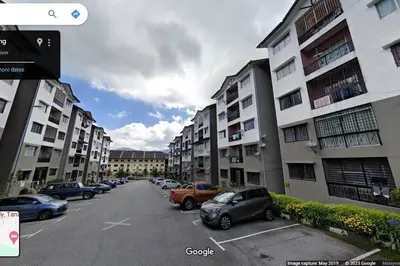 a street with cars parked in a parking lot next to buildings at CH Homestay Tanah Rata, Cameron Highlands, Keyless Entry in Tanah Rata