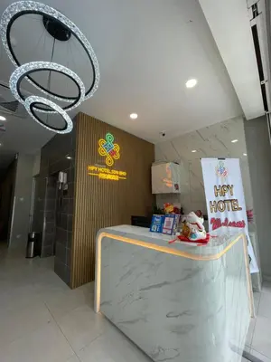 a happy hour counter in a restaurant with a chandelier at HPY Hotel in Ipoh