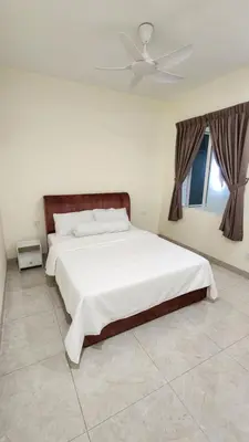 a bedroom with a white bed with a ceiling fan at La Belle Maison 12 @ Gurney Kelawai/Pulau Tikus/Georgetown in George Town