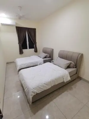 two beds sitting in a room with at La Belle Maison 12 @ Gurney Kelawai/Pulau Tikus/Georgetown in George Town