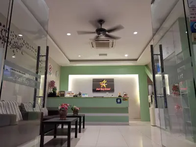 a store lobby with a star on the monitor in the ceiling at Star Bay Hotel in Lumut