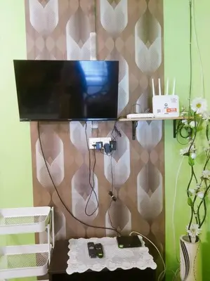 a television sitting on top of a table at Syukur Homestay Ipoh in Ipoh
