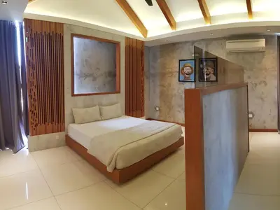 a bedroom with a bed in a room at Ipoh Santorini Hideaway - Hotel Inspired in Ipoh