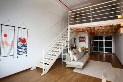 a living room with a loft bed and a staircase at Private Zen at The CEO Bayan Lepas Penang in Bayan Lepas