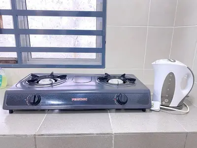 a stove sitting on a counter in a kitchen at WawAmir Homestay @ Seri Iskandar in Seri Iskandar