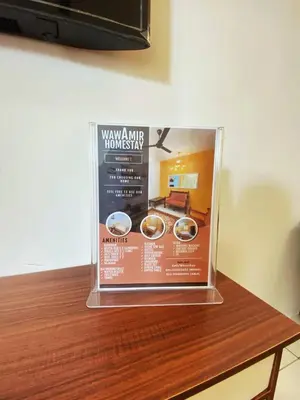 a display on top of a wooden table with two rings at WawAmir Homestay @ Seri Iskandar in Seri Iskandar