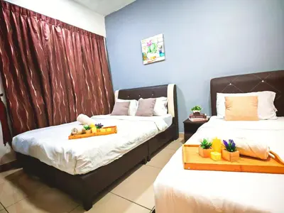 a bedroom with two beds with plants on them at Ipoh City Centre Majestic 2 Room Condo near Gerbang Malam by City Home Empire in Ipoh