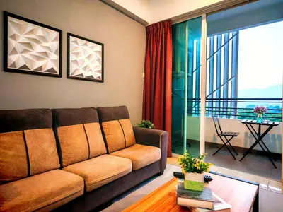 a living room with a couch and a balcony at Ipoh City Centre Majestic 2 Room Condo near Gerbang Malam by City Home Empire in Ipoh