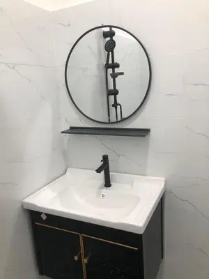 a bathroom with a sink and a mirror at SKYN SMART HOME in Ipoh