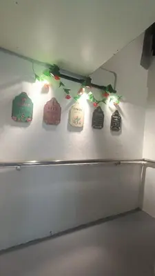 a shelf with christmas lights on a wall at 5-Person 1950s Shophouse Vintage Charm Nflix Disney Plus in Taiping