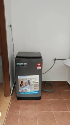 a trash can sitting on the floor in a room at 5-Person 1950s Shophouse Vintage Charm Nflix Disney Plus in Taiping