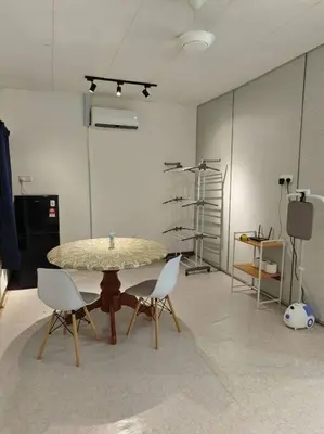 a room with a table and chairs in a room at 5-Person 1950s Shophouse Vintage Charm Nflix Disney Plus in Taiping