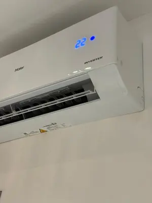 a white microwave oven sitting on top of a wall at Stylish Balinimo Guest room - King Bed, Free Netflix, Prime & Wi-Fi Near Bukit Mertajam in Kubang Semang