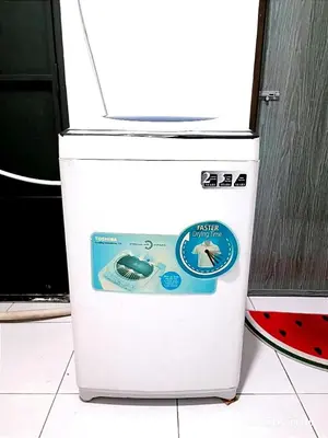 a white refrigerator with a sign on top of it at HOMESTAY NAFISAH in Tapah Road