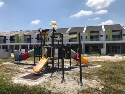 a playground with slides in front of a building at HOMESTAY NAFISAH in Tapah Road