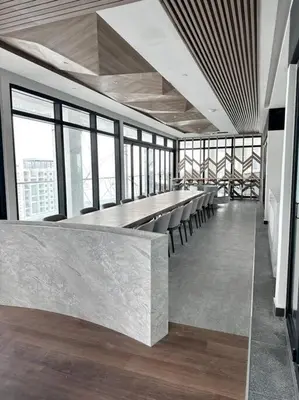 a row of chairs in a large room with windows at Georgetown Modern Stylish Urban 3BR, InfinityPool with Seaview, 3 Queen bed in Jelutong