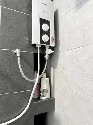 a soap dispenser on the side of a wall at Georgetown Modern Stylish Urban 3BR, InfinityPool with Seaview, 3 Queen bed in Jelutong