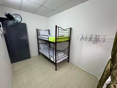 a room with a room with a shelf with towels at Homestay Cikgu Iqa (Muslim) in Kuala Kangsar