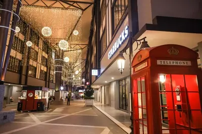 a red phone booth in the middle of a street at Emerald Avenue Brinchang 8 guests 3 bedrooms in Brinchang