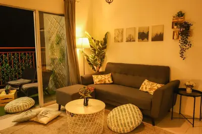 a living room with a couch and a table at Emerald Avenue Brinchang 8 guests 3 bedrooms in Brinchang