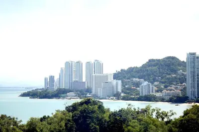 a view of a city with tall buildings and the water at Shamrock Breeze Villa: Coastal Haven for 29 Guests in Batu Ferringhi