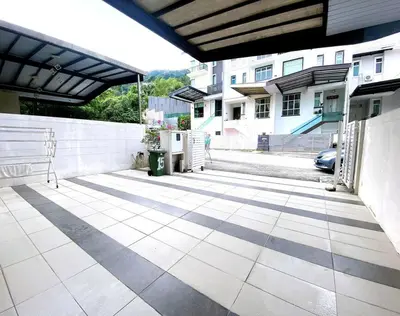 an outdoor patio with awning in a building at Shamrock Breeze Villa 2: Coastal Haven for 25 Guests in Batu Ferringhi