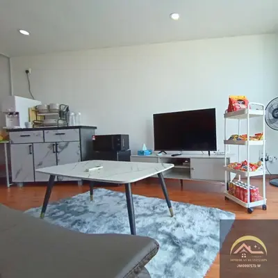 a living room with a table and a flat screen tv at Minimalist Duplex @ BayanLepas in Bayan Lepas