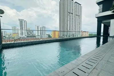 a large body of water with buildings in the background at Deluxe Seaview Georgetown Penang @ ComfyLux Homestay in Jelutong