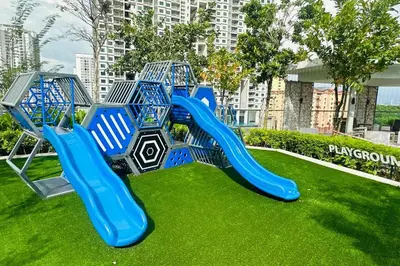 a playground in a park with a blue slide at Deluxe Seaview Georgetown Penang @ ComfyLux Homestay in Jelutong