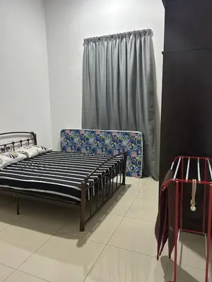a bedroom with two bunk beds and a couch at Homestay De' Afraa Sungai Besar IslamFriendly in Sungai Besar