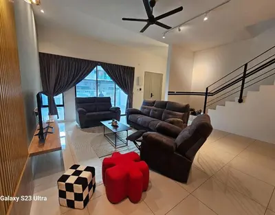 a living room with two couches and a ceiling fan at Sunway Ipoh - DamaiStay - 5min to Tambun - 20Pax in Tambun