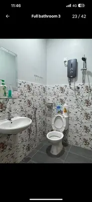 a bathroom with a toilet and a sink at BOTANI LOFT HOMESTAY in Ipoh
