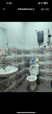 a bathroom with a toilet and a sink at BOTANI LOFT HOMESTAY in Ipoh
