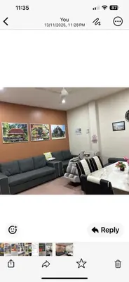 a living room with a couch and a table at BOTANI LOFT HOMESTAY in Ipoh