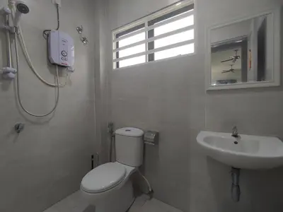 a bathroom with a toilet and a sink at Ipoh Tambun Sunway next to Heaven Spacious Luxury Home in Kampong Batu Lapan