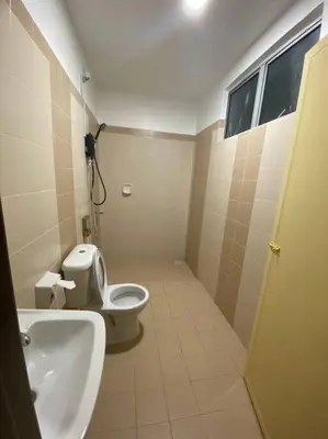a bathroom with a toilet and a sink at SmartChoice Homestay in Bukit Mertajam
