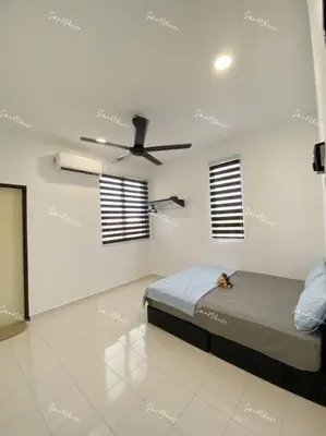 a bedroom with a bed and a ceiling fan at SmartChoice Homestay in Bukit Mertajam