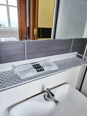 a bathroom with a sink and a mirror at The 60 in George Town