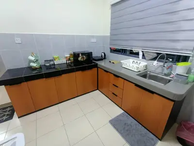 a kitchen with a sink and a counter top at D’Kayangan Homestay BBSAP Sitiawan in Sitiawan