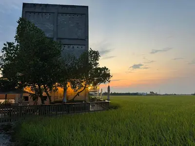 a building in the middle of a field with a tree at MostPopular!!! Hay Cafe TranquilFields - OnlyYou with Hay, Rentable For Event in Sekincan