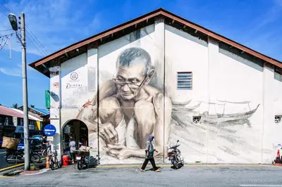 a mural of a man on the side of a building at Stewart Hotel at 67 By EVR - Newly Renovated 2024 in George Town